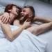 couple laughing bed 6841f646084ee
